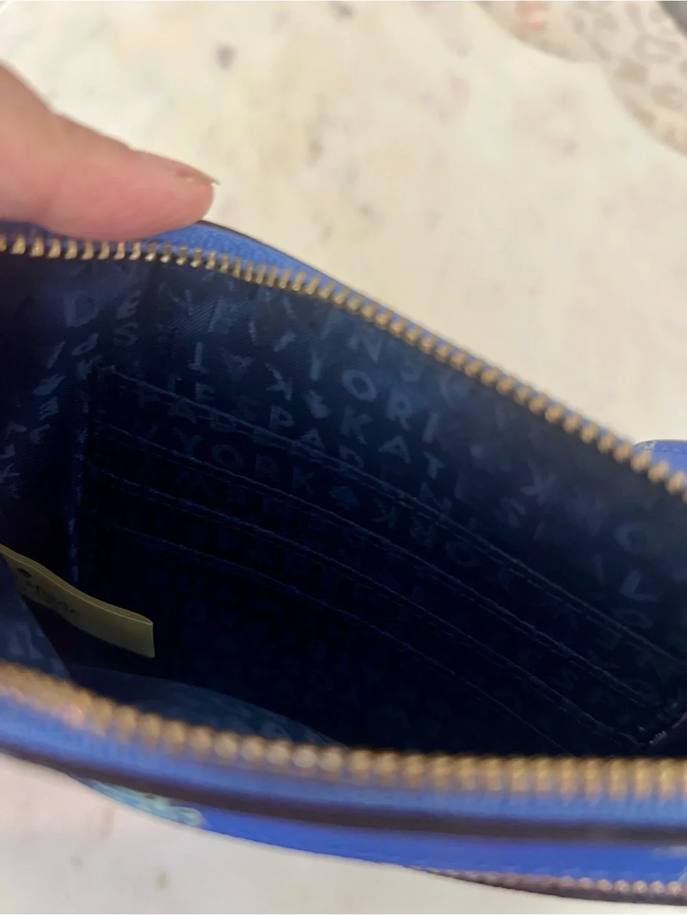 kate spade cobalt blue seahorse wristlet clutch